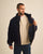 Homme portant la doudoune puffer navy bleu ouverte Côtelé Paris